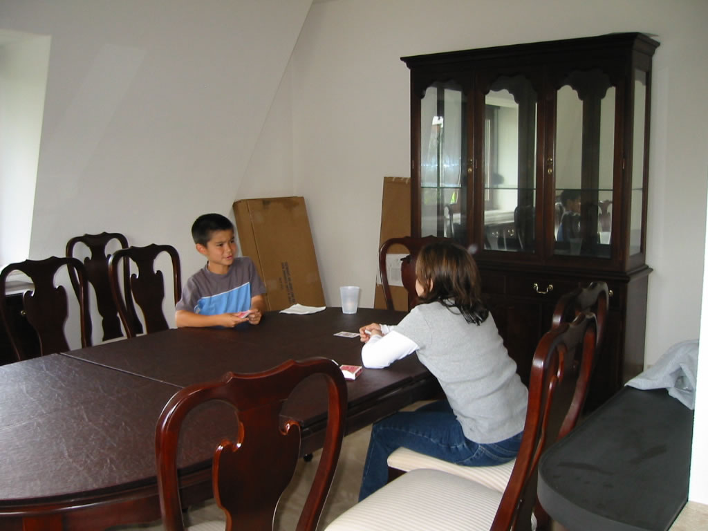 Dining room (and game-playing room).  Furniture throughout house is standard govt issue.