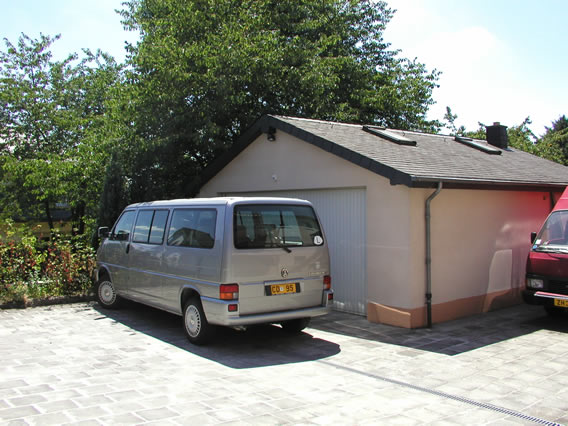 The garage in back of the house, and the embassy van parked next to it (too big to fit).
