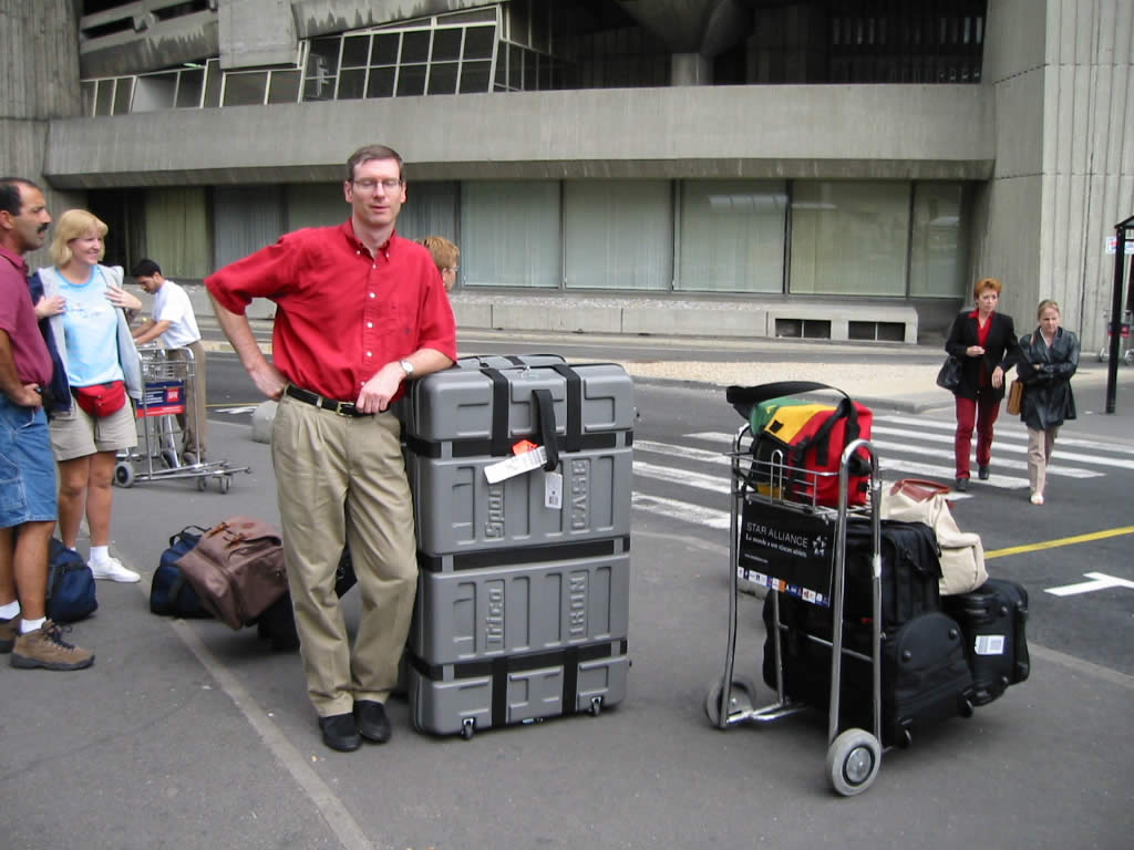 Phil with our luggage waiting for the Gare de TGV shuttle